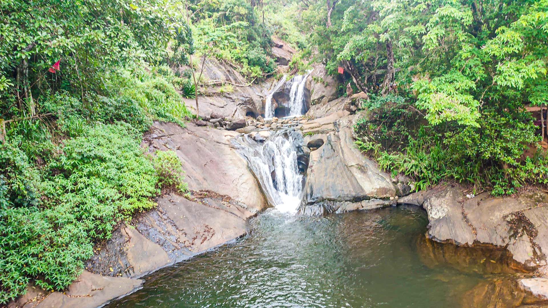 Bambarakiri Ella Waterfall with suspension bridge in Knuckles forest, Matale District